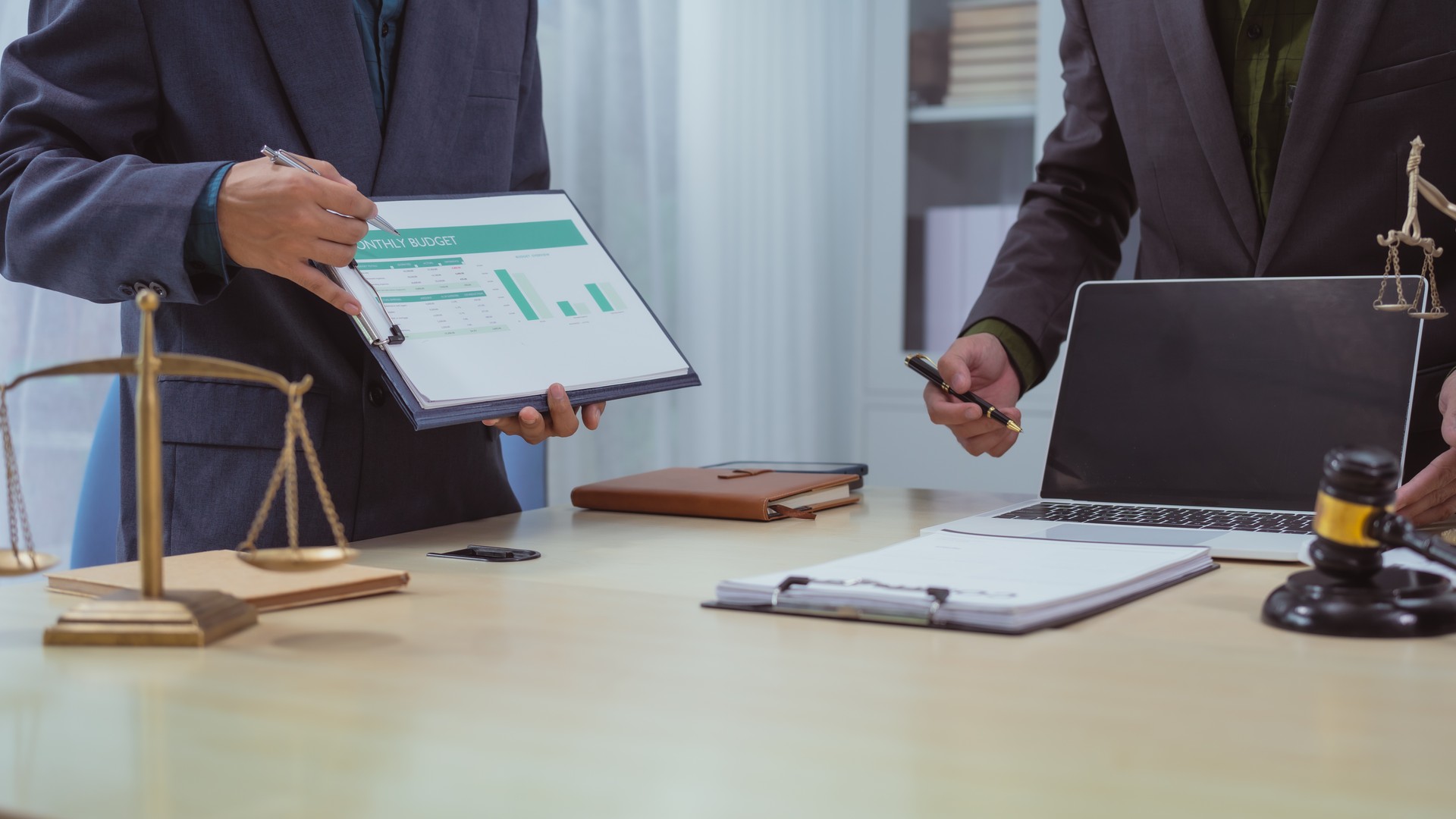 Attorneys reviewing business governance documents