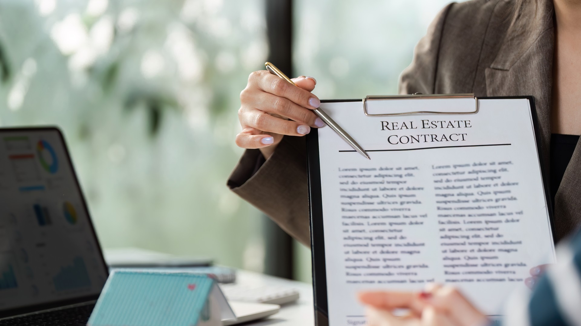 Attorney reviewing a real estate contract with a client