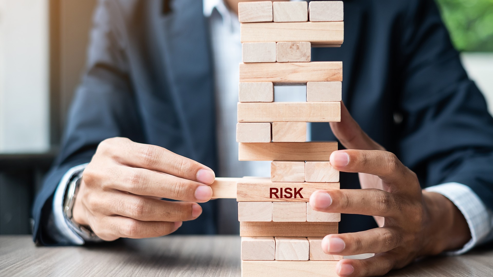 Business risk management represented with wooden blocks
